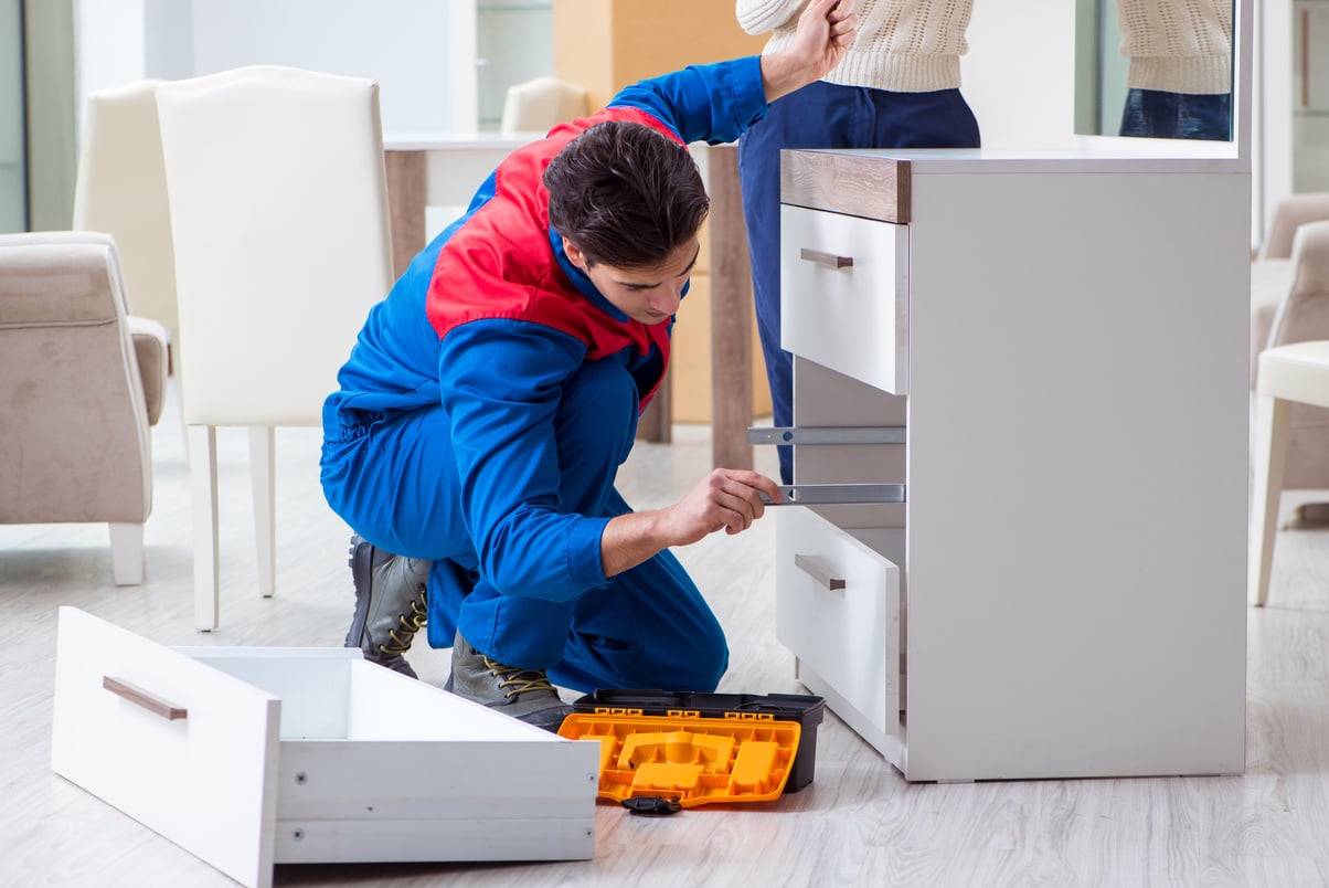 Contractor Repairman Assembling Furniture  